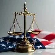 Brass balance scale on an American flag background